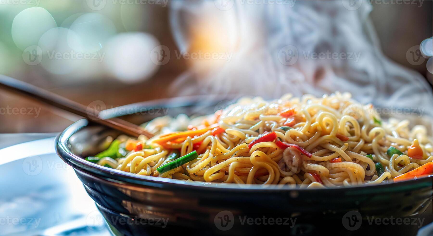 A bowl of noodles with a wooden spoon photo