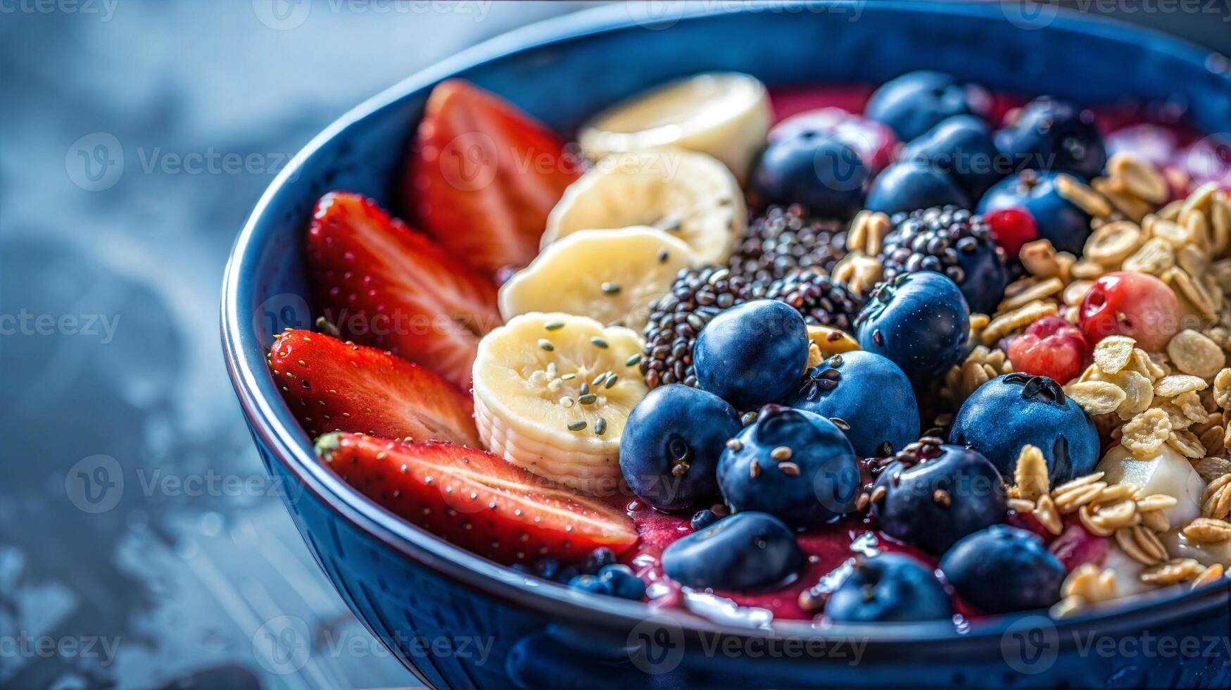 A bowl of fruit and berries with granola and granola photo