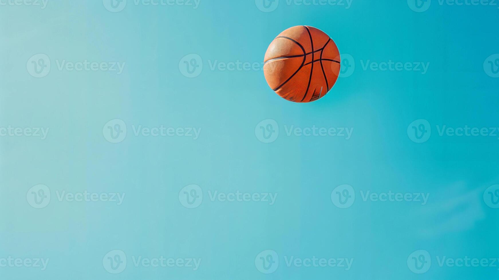Basketball ball in the air on a blue background photo