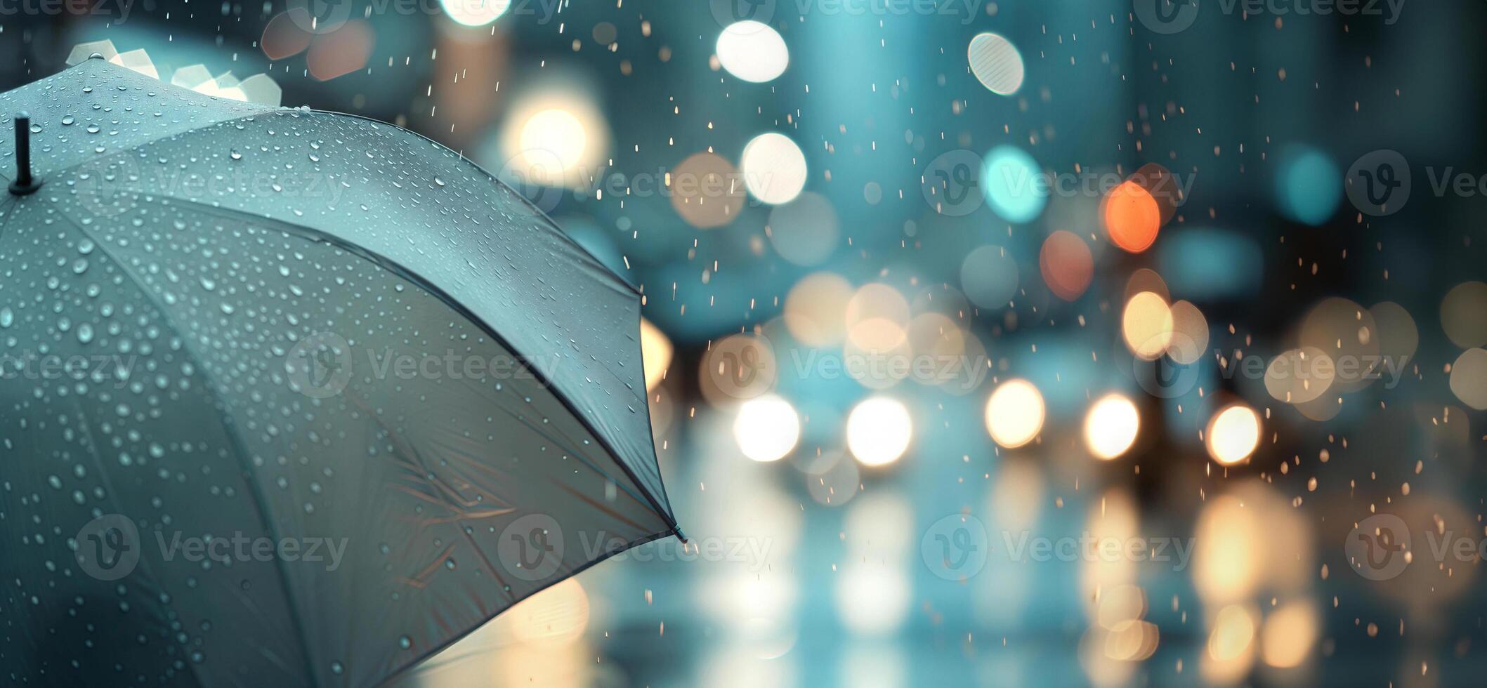 A wet umbrella in the rain photo