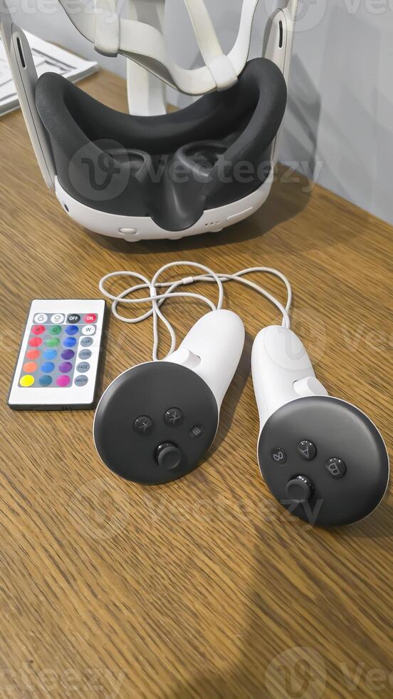 Virtual game set. VR headset. Glasses are on the table next to the control panel photo