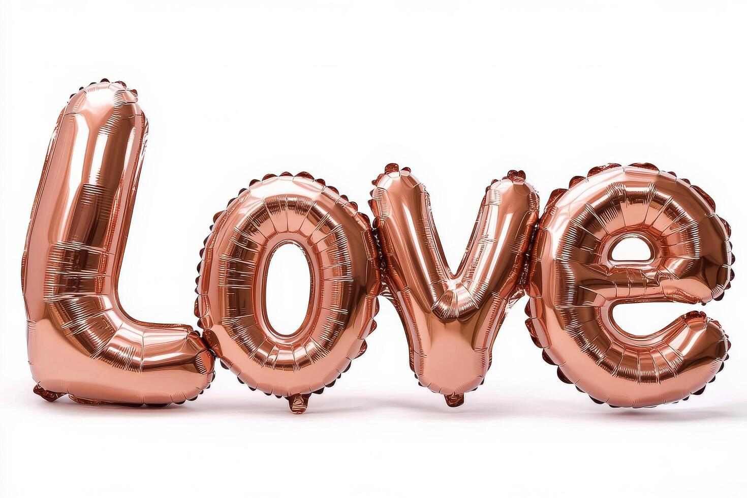 Shiny rose gold balloons spelling love arranged for a celebration or special occasion photo