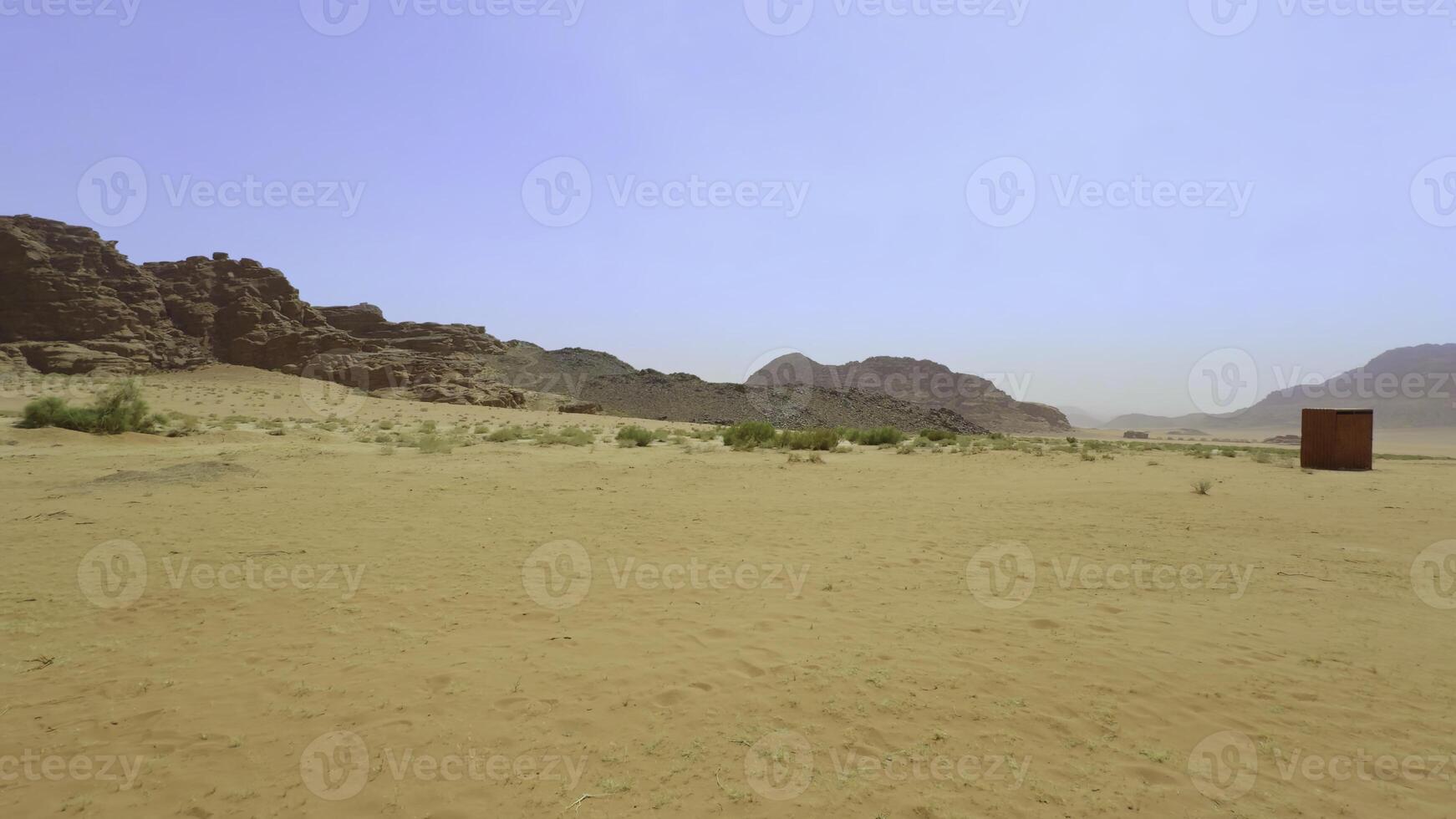 Enjoy a breathtaking view of a captivating desert setting framed by stunning natural beauty. Action photo