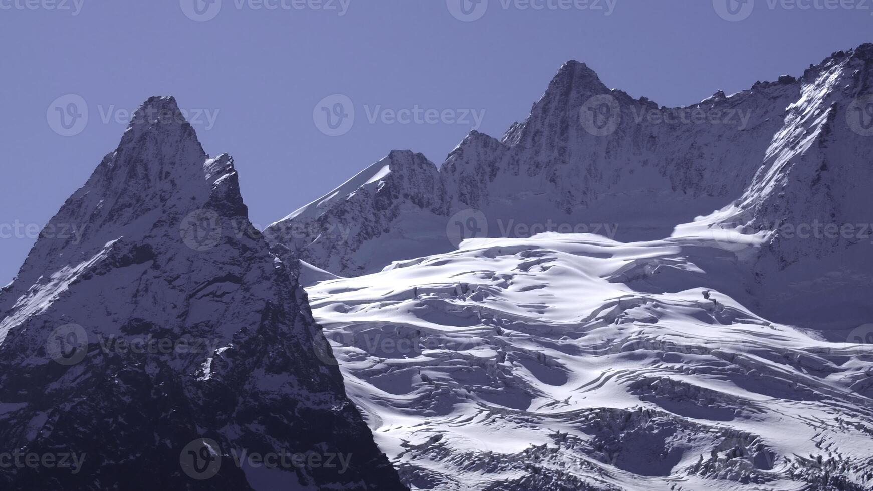 Fairytale mountain landscape, covered by ice and snow alpine sharp peaks. Creative. Wild winter untouched inaccessible nature. photo
