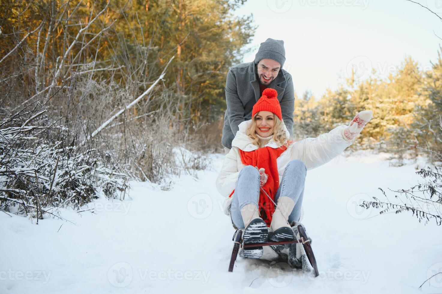 Photo of young attractive couple happy positive smile look each other enjoy time together forest winter love story