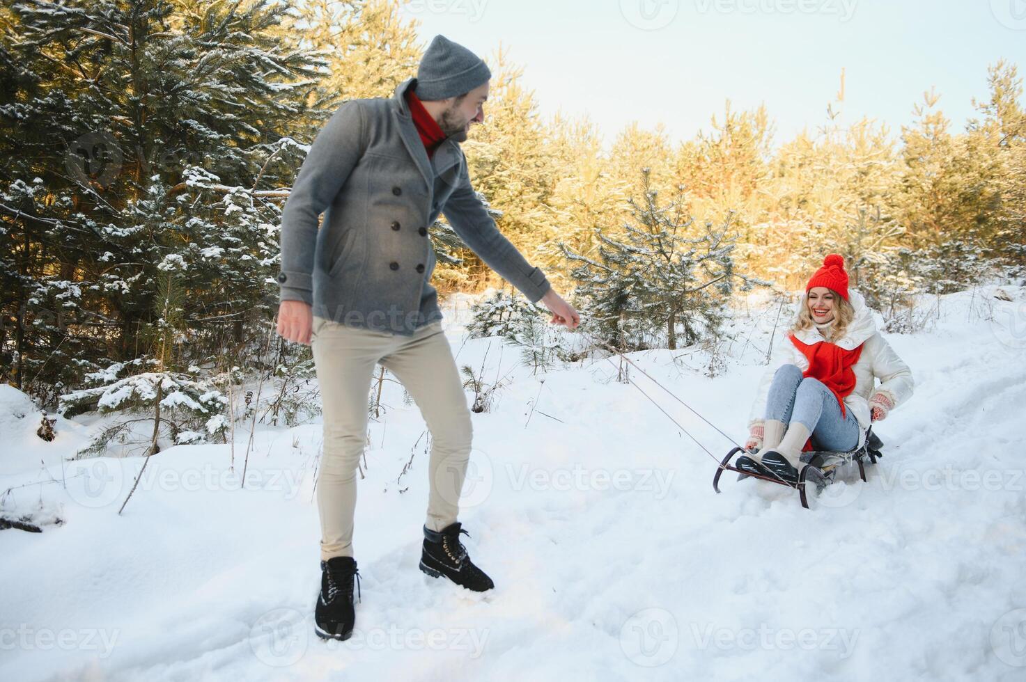 Photo of young attractive couple happy positive smile look each other enjoy time together forest winter love story