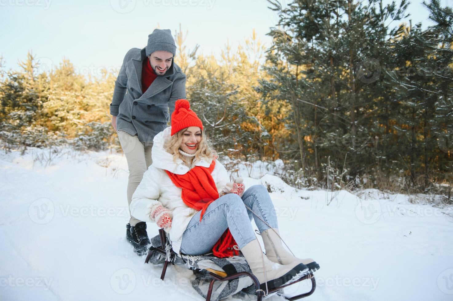 Photo of young attractive couple happy positive smile look each other enjoy time together forest winter love story