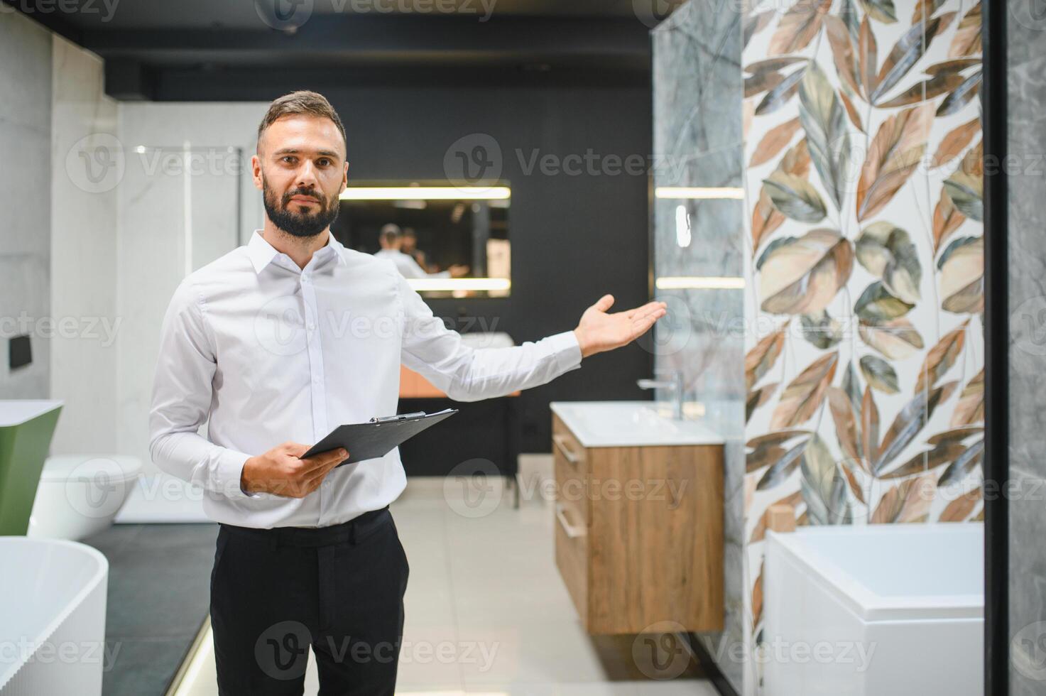 Portrait of seller in bathroom store. Happy man works in bath store. Sales occupation photo