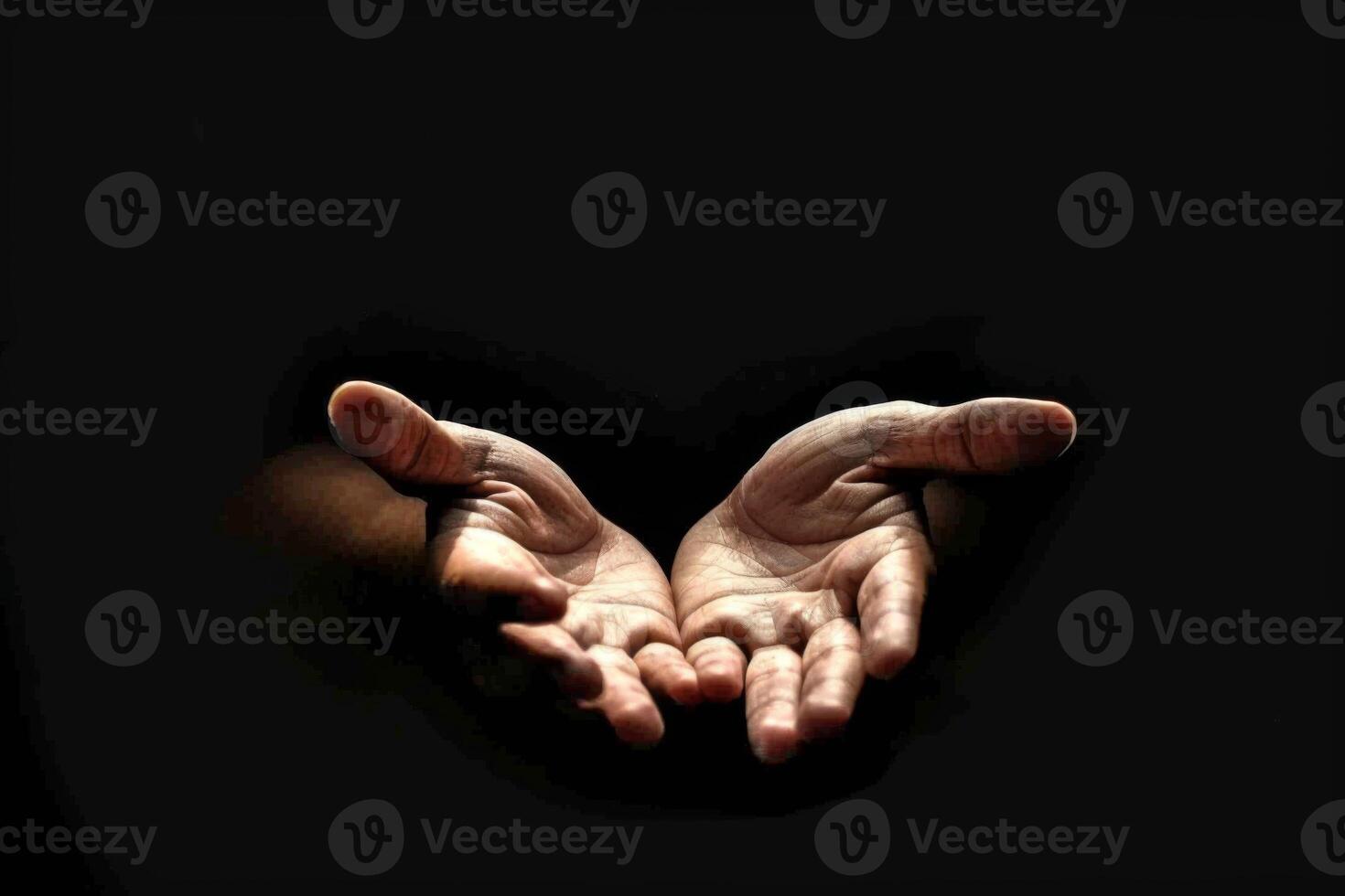 Outstretched hands symbolizing hope and connection against a dark background photo