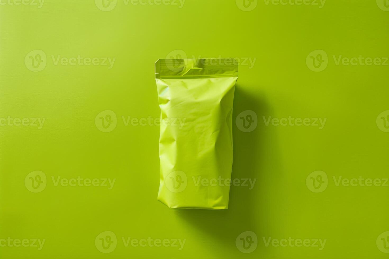 Bright yellow packaging on a vibrant green background creates an eye-catching minimalist design photo
