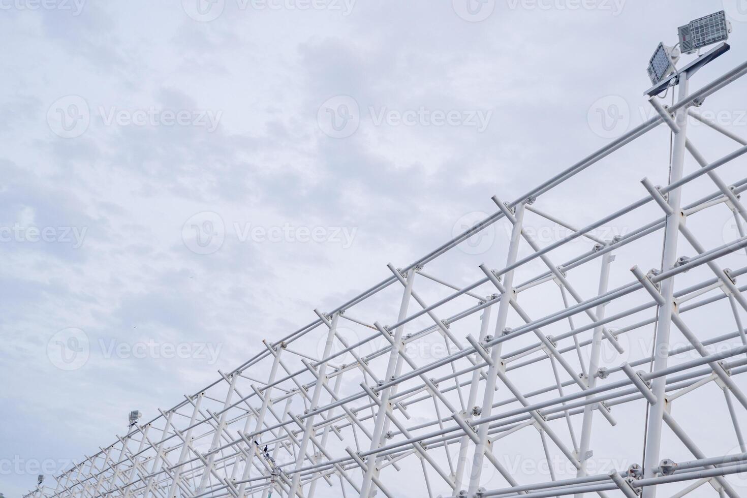White Metal Structure Against Cloudy Sky photo