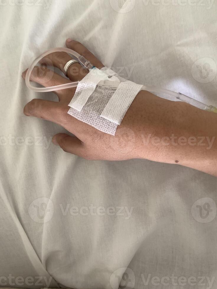 Close-up of a Hand with IV Drip photo