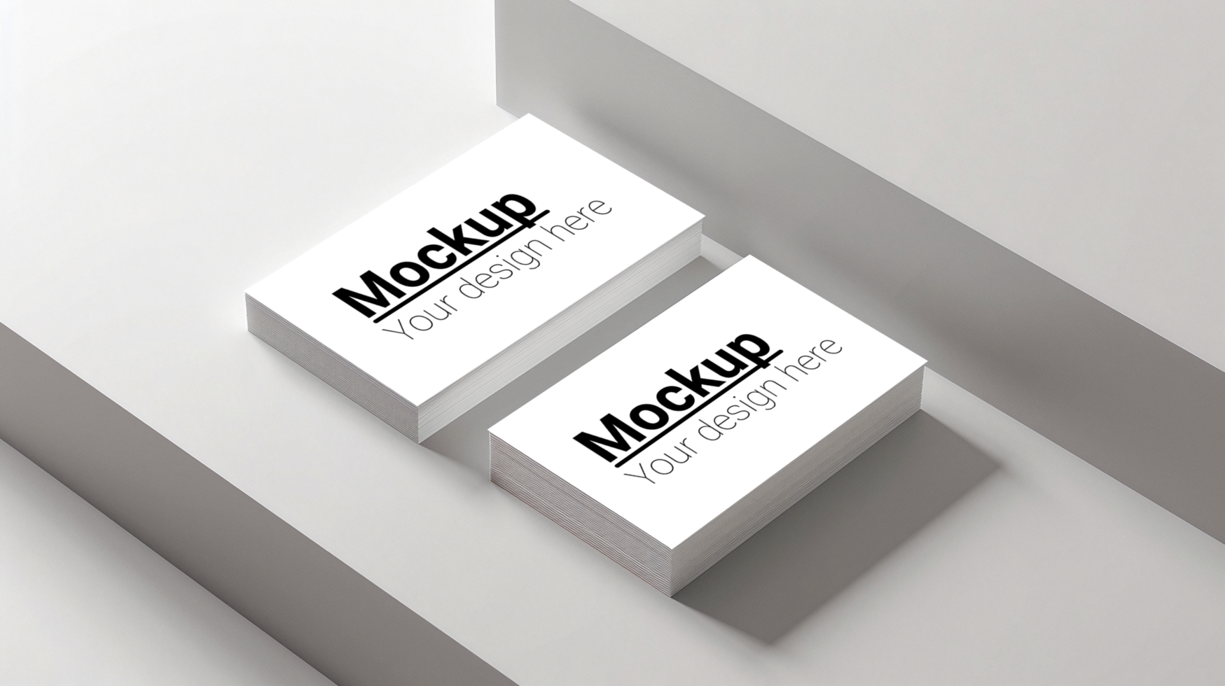 Two business cards mockup on a white surface psd