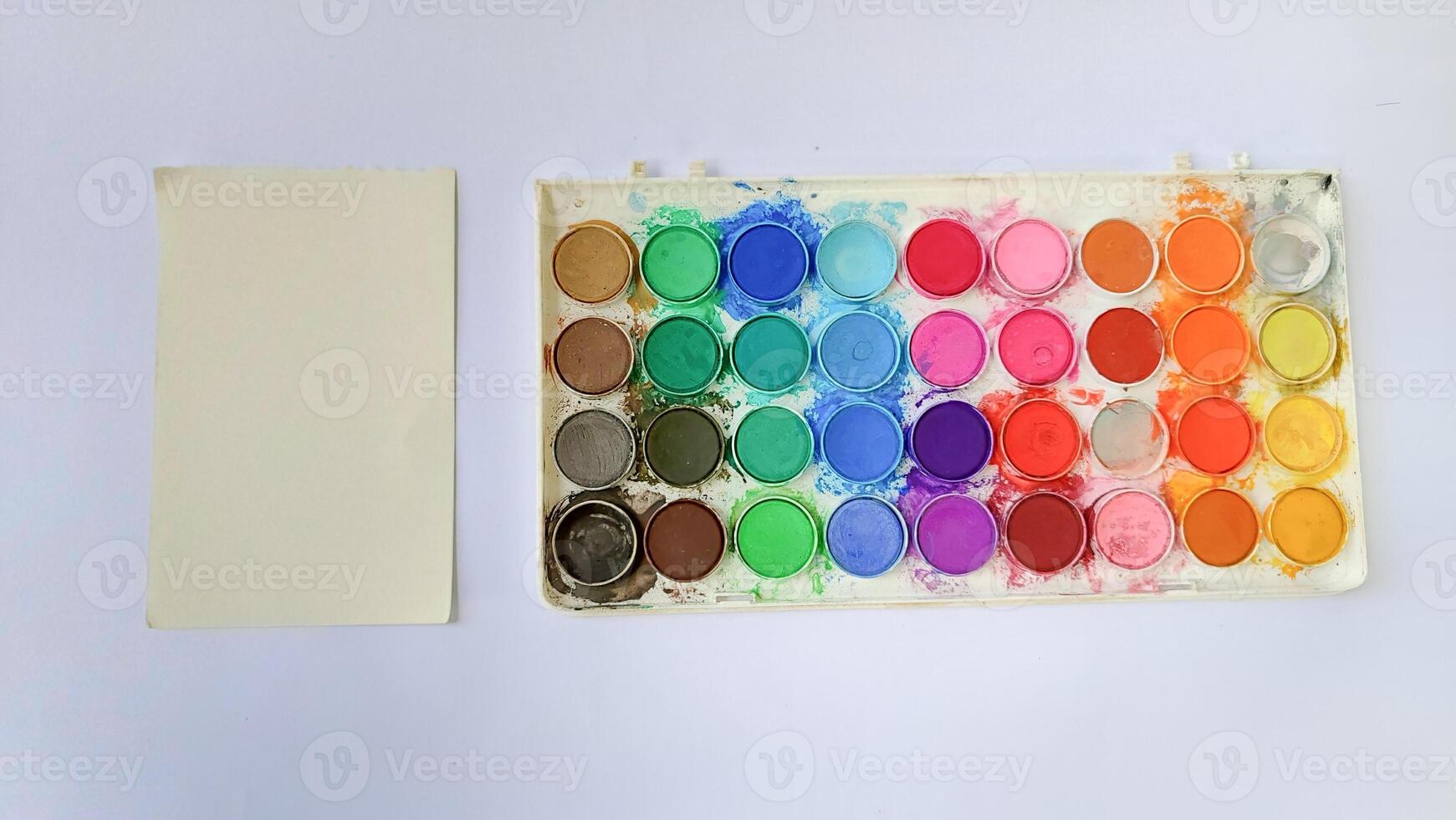 Set with strokes of colorful oil paints on white background, top view photo