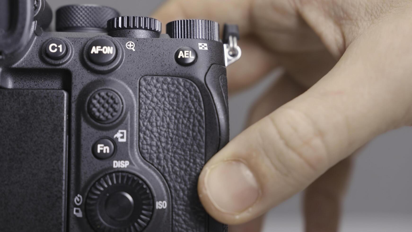 RUSSIA, MOSCOW-DECEMBER, 2020. Memory card in camera. Action. Close-up photographer inserts new memory card into camera. Replacing memory card in camera photo