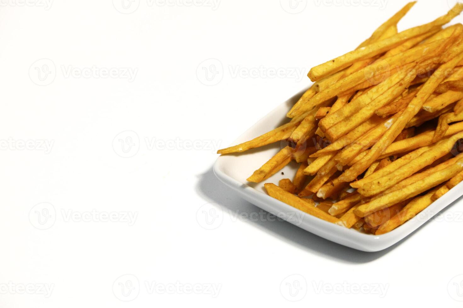 Sweet potato sticks on white background photo