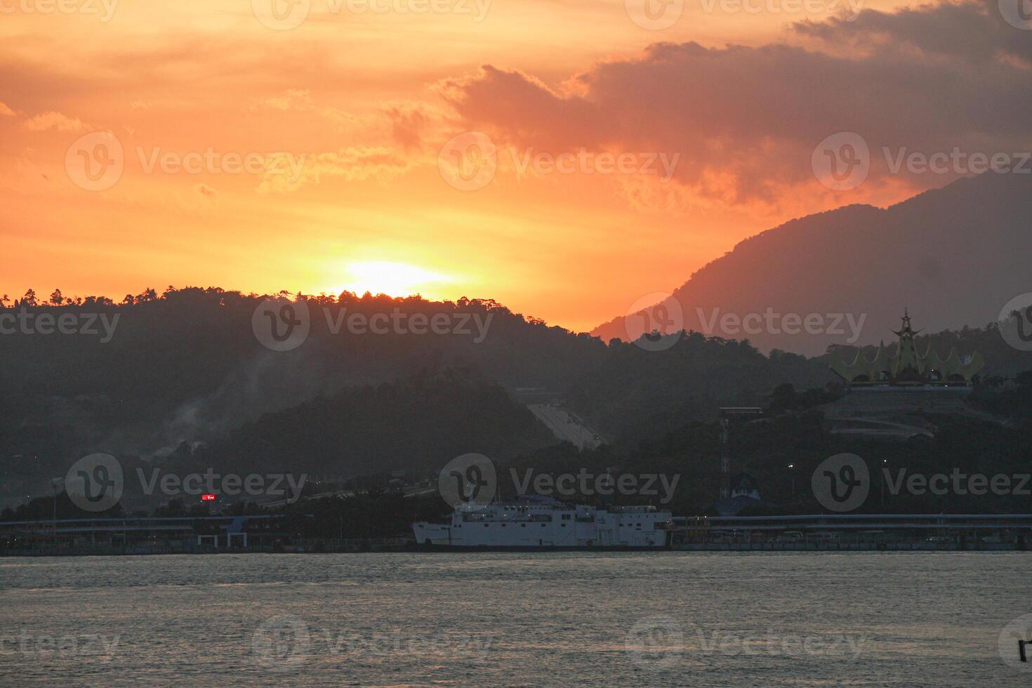 Landscape view between the sky and the vast sea, located at Sunda Strait, Lampung, Indonesia photo