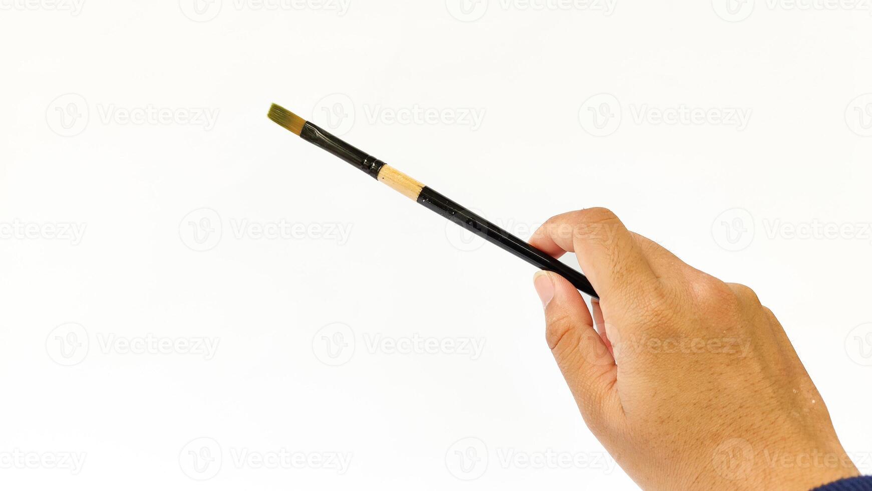 Different brushes with paints on white background photo