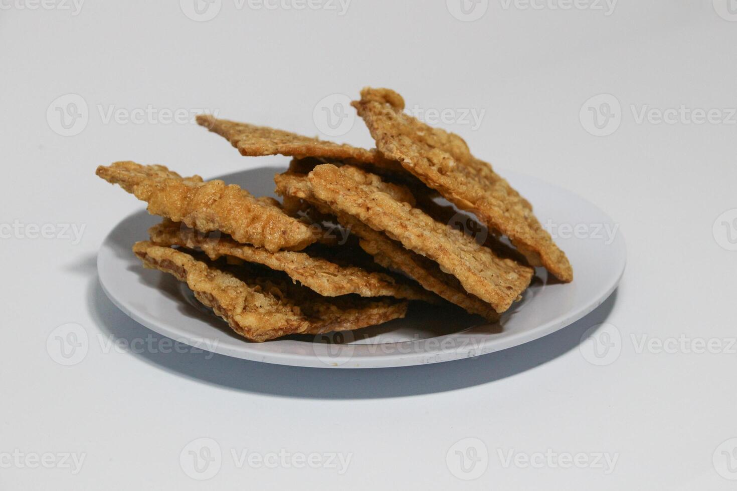 tempe or keripik tempe or kripik tempe. tempeh chips a typical Indonesian food made from soybeans and thinly sliced photo
