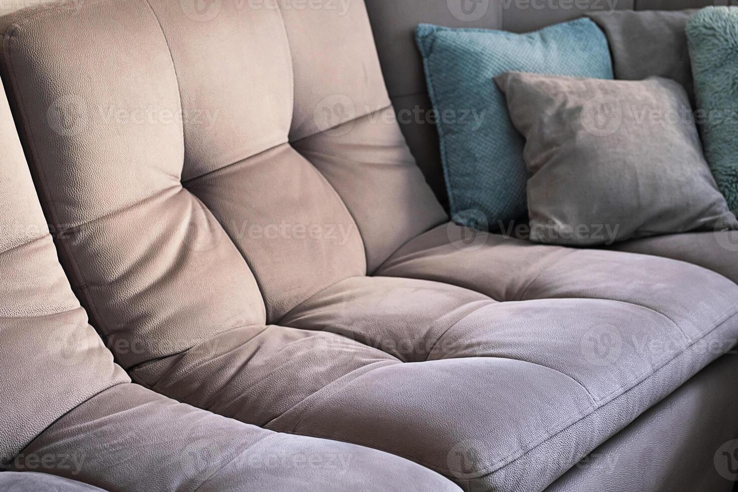 Various cushions placed on couch. photo