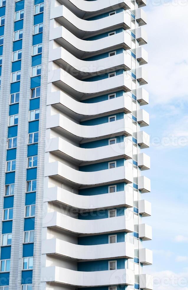 Modern apartment building featuring unique balconies. photo
