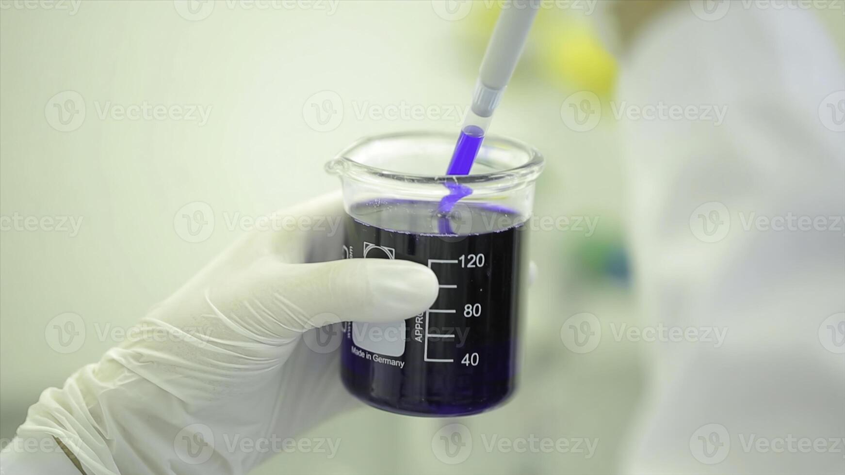 Test tubes closeup. Medical equipment. Close-up footage of a scientist using a micro pipette in a laboratory. Laboratory technician injecting liquid into a microtiter plate. Test tubes. Small depth of photo
