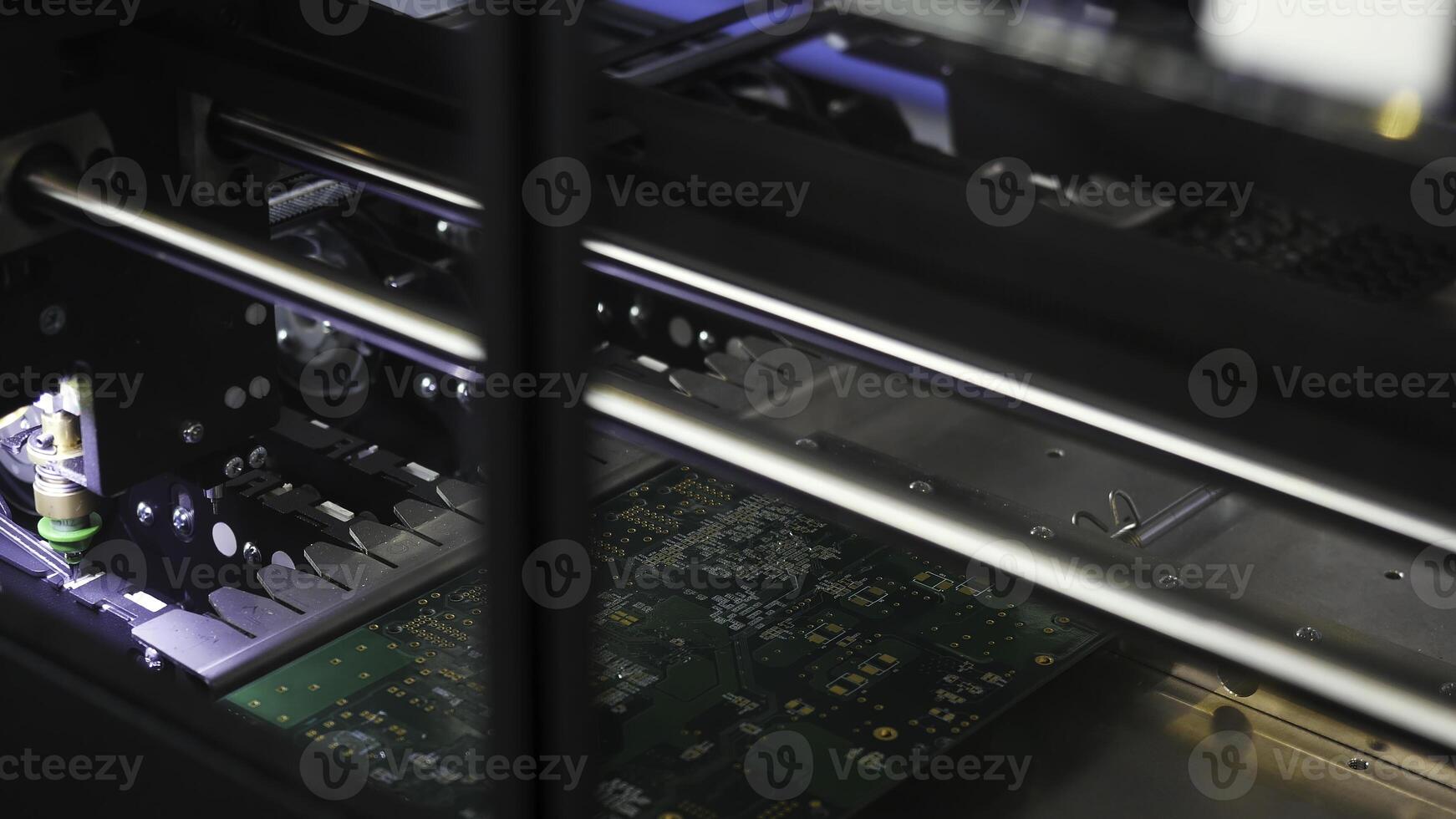 Close up for the robotic mechanism soldering the chip at the computer factory, technology and digital concept. Media. Automated process of chip soldering. photo
