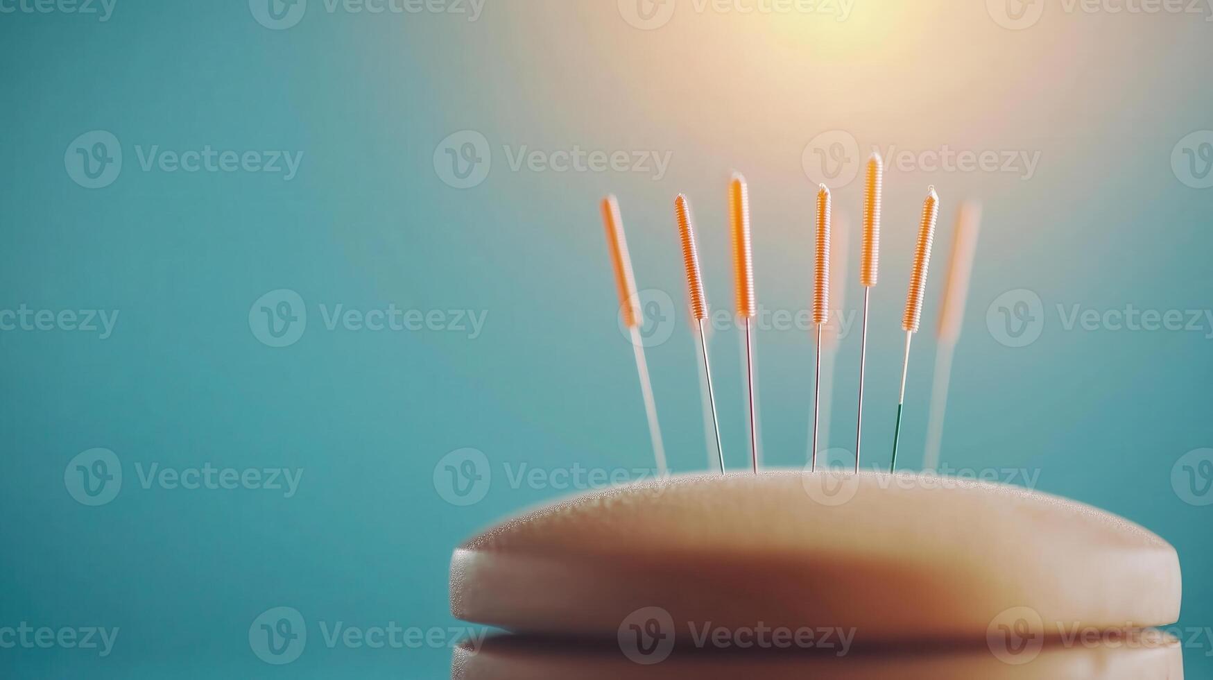 A close-up of an acupuncture treatment showing needles carefully positioned over a soft cushion, set against a soothing blue backdrop for relaxation and healing. photo