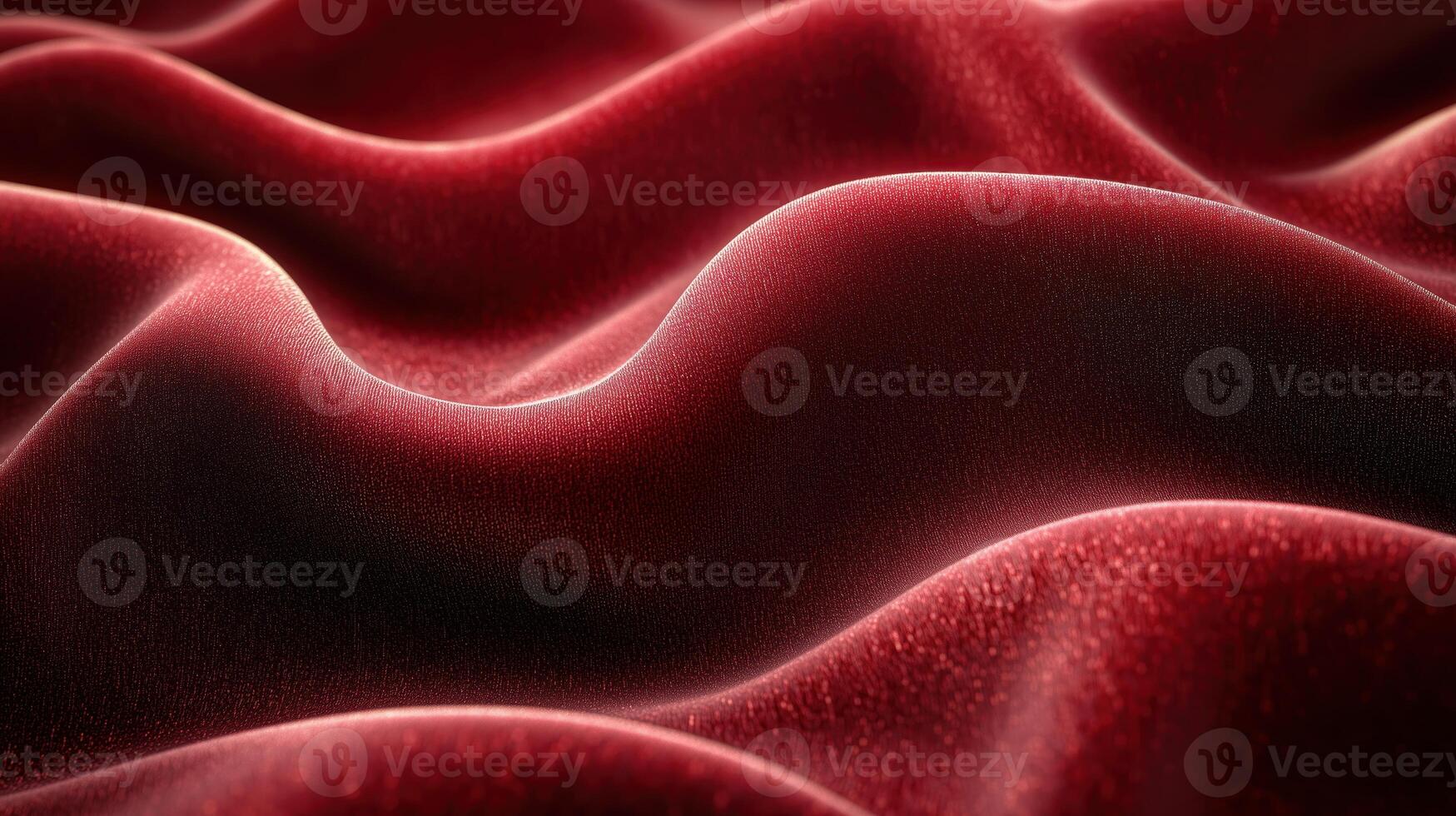 Close-up of luxurious red velvet fabric with smooth, flowing texture and rich color highlights. photo