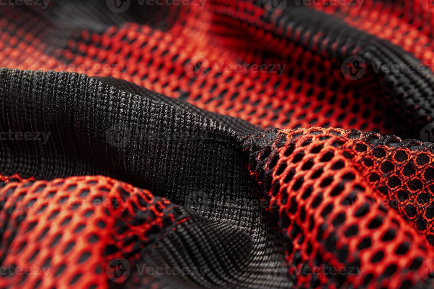A close up of a red and black fabric with a mesh pattern photo