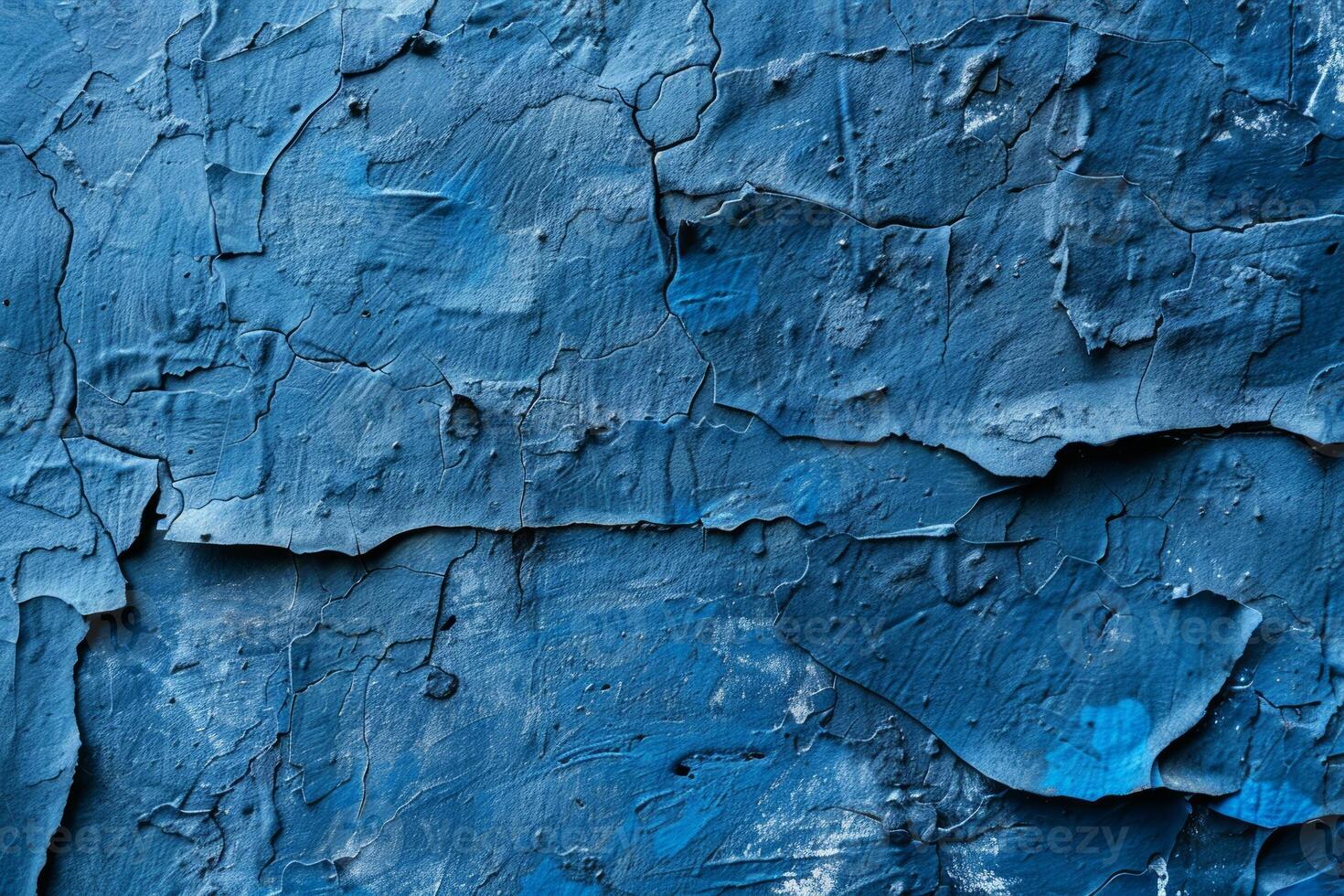 Blue wall with cracks and peeling paint. Grunge texture background for design projects. photo