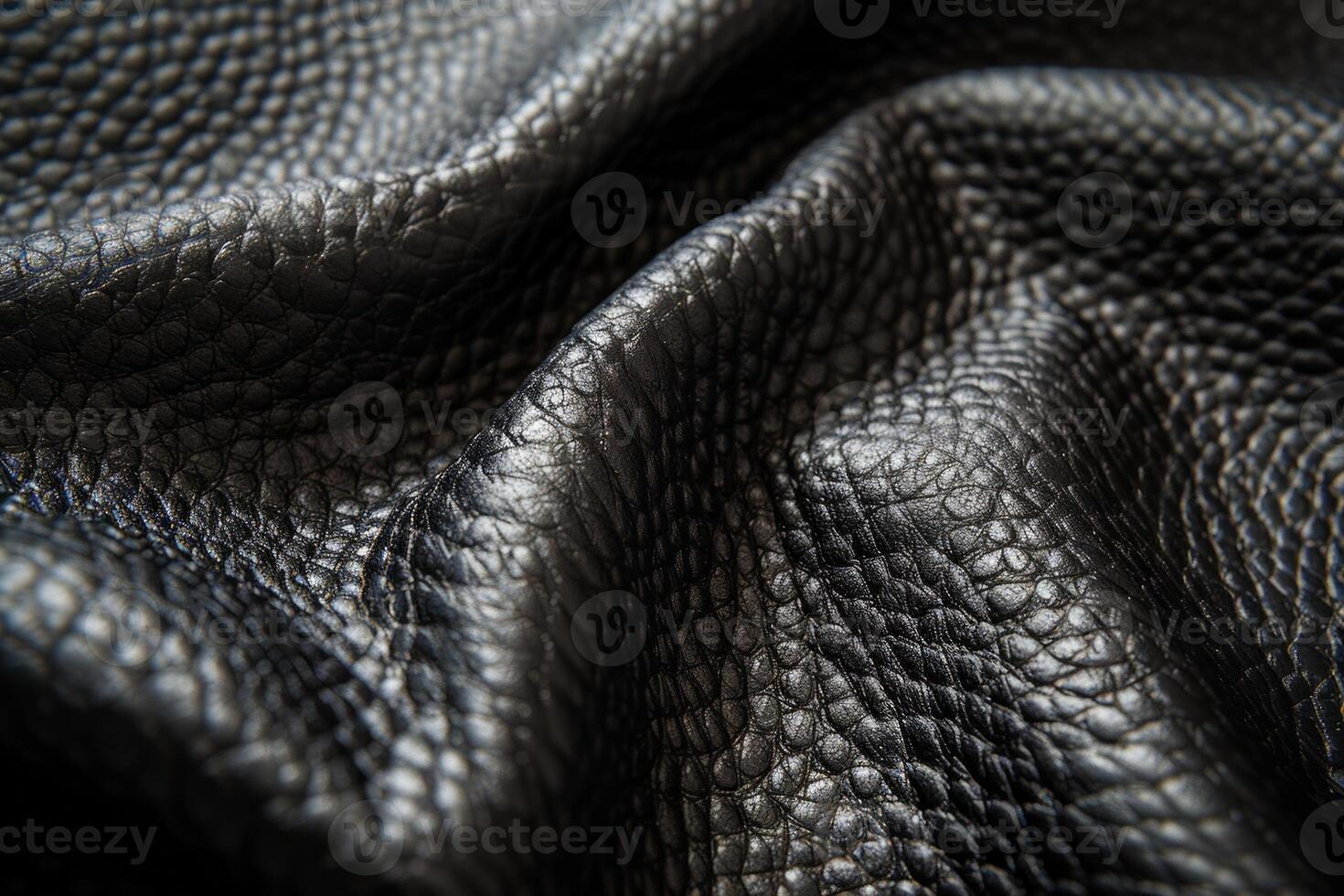 The leather is black and has a very textured appearance photo