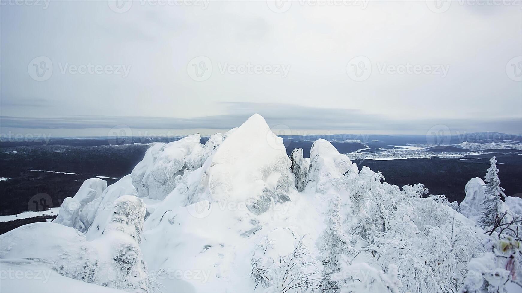 Great panorama view of the snowy massive mountain with mountain cliff. Landscape and gorgeous scene. . winter landscape in a mountain valley with snow. Mountains with snow and blue sky photo