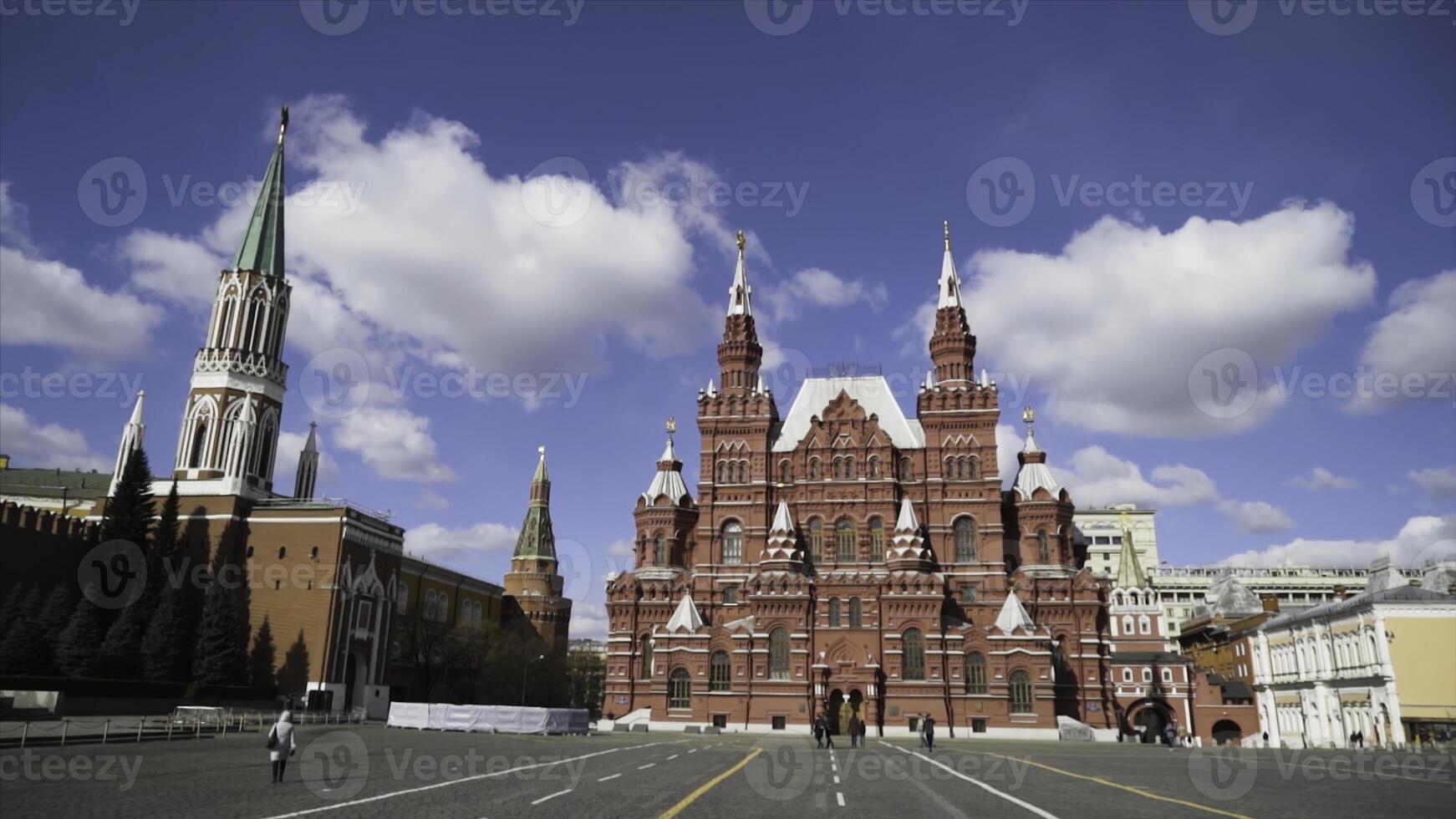 View of square near red square with walking tourists on background of towers. Action. Historical heritage of Russia and famous landmark is Red square photo