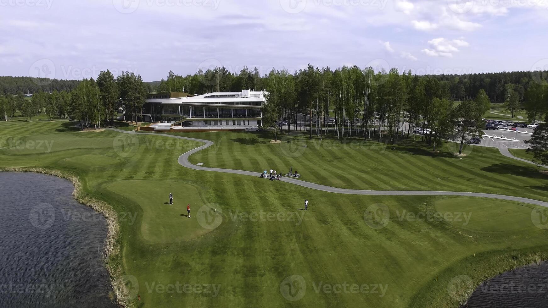 Golf course on a Sunny day, an excellent Golf club with ponds and green grass, view from the sky photo