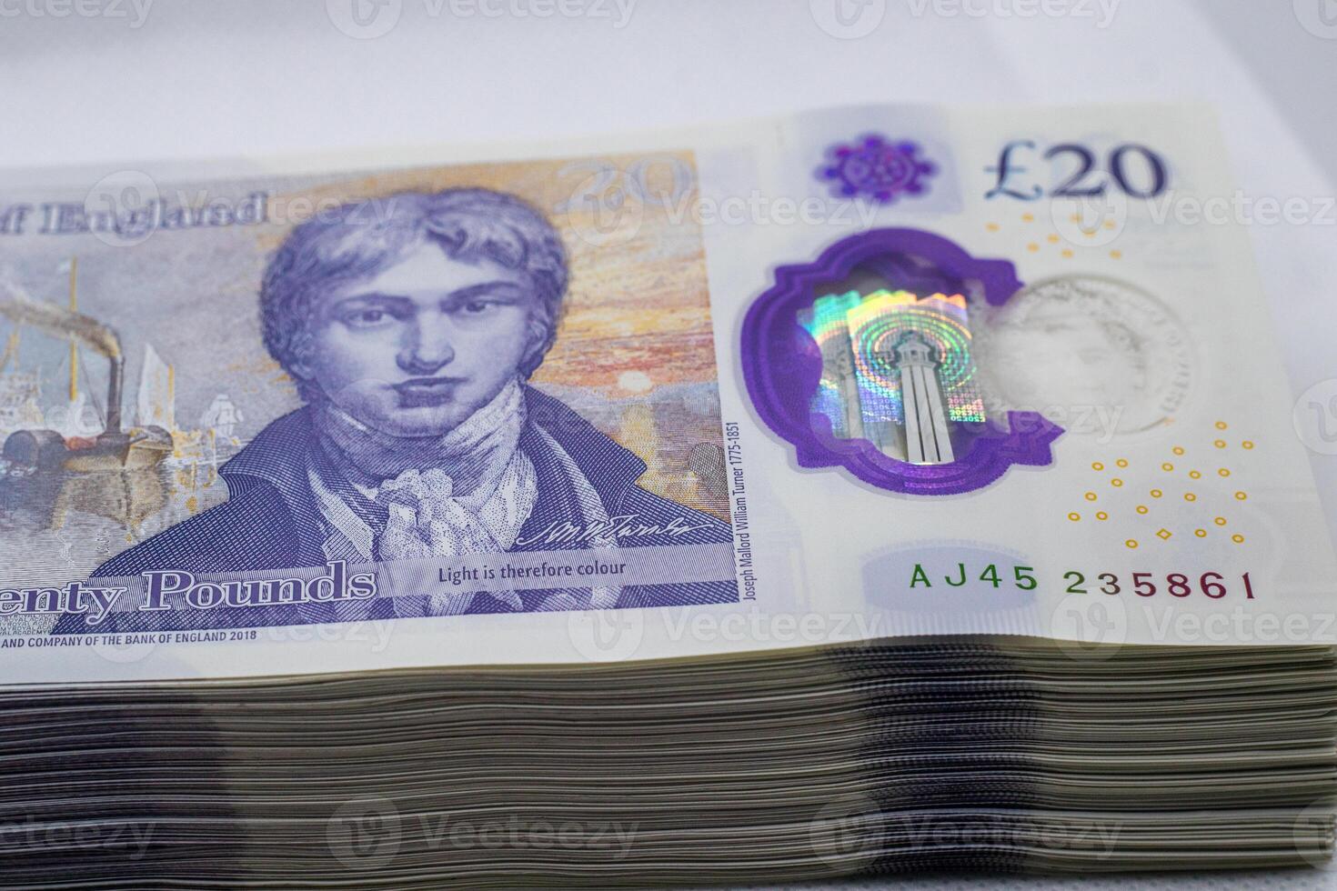 A stack of twenty pound notes photo