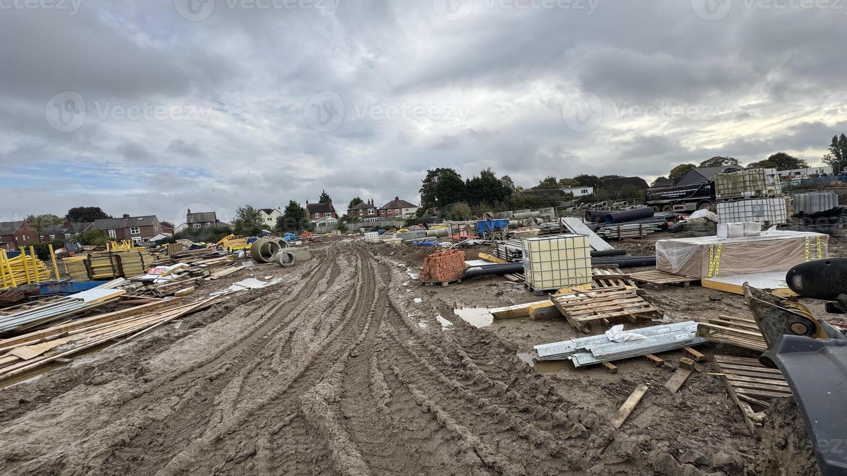 Construction Site with Building Materials and Overcast Sky photo