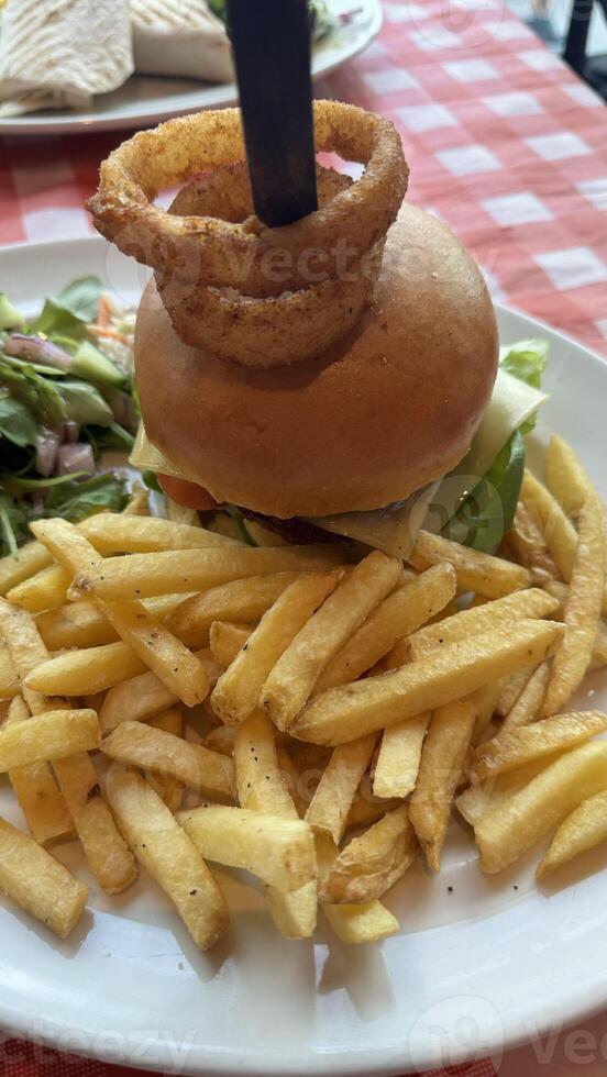 Burger with Onion Ring and Fries photo