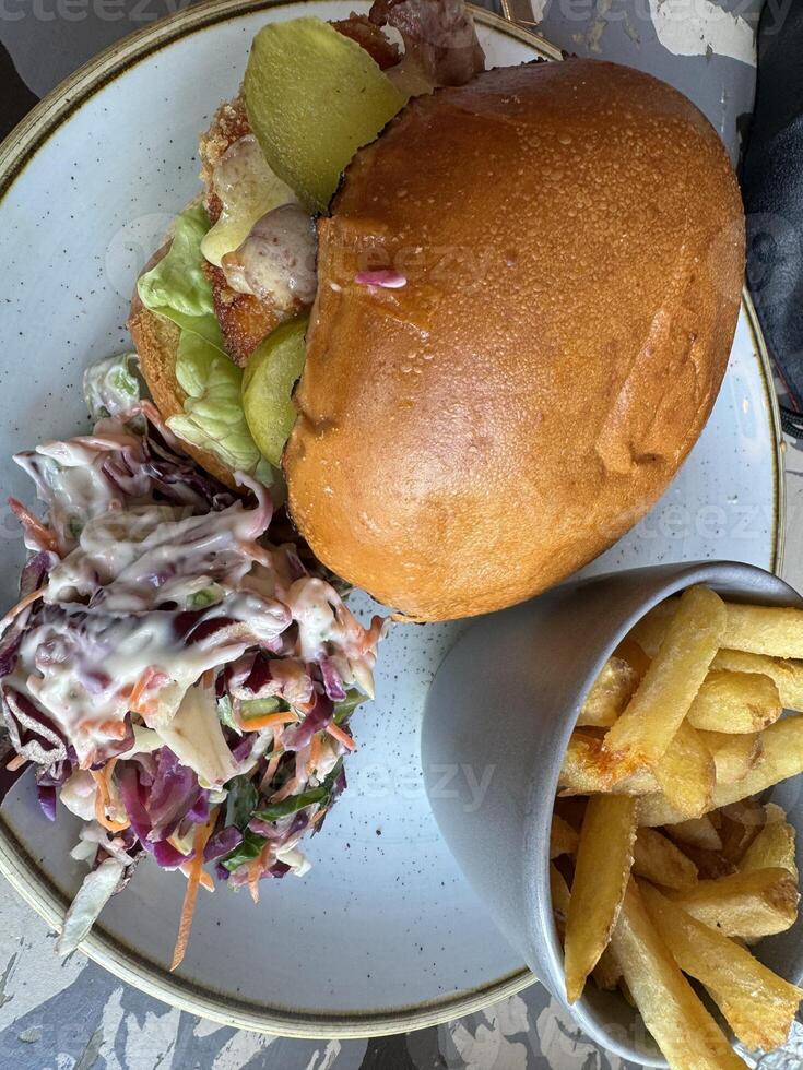 Delicious Burger with Fries and Coleslaw photo