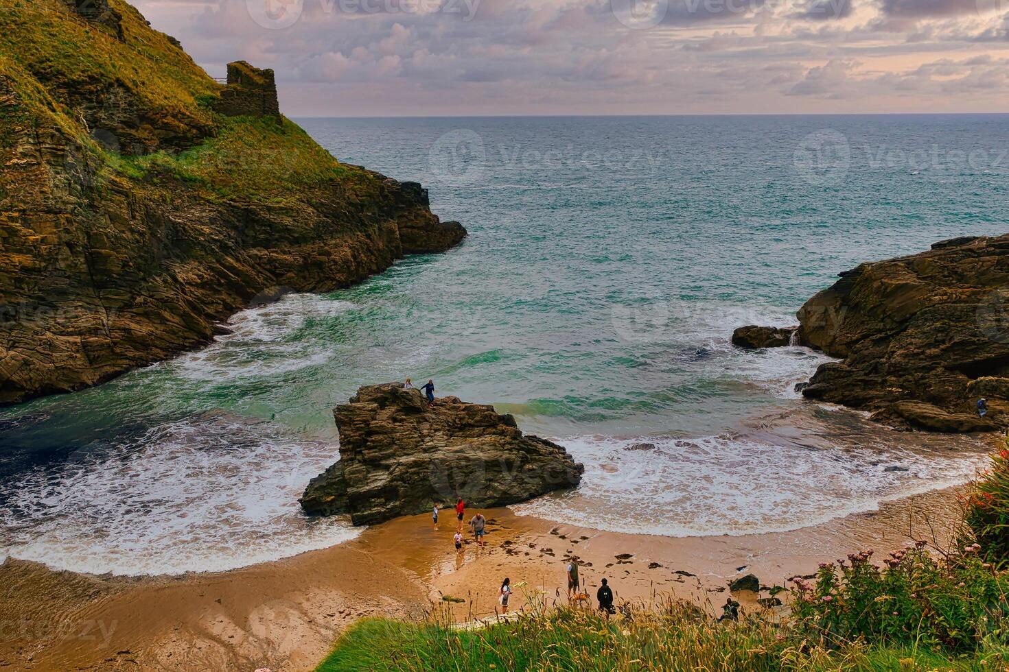 Serene Coastal Beach with Rocky Cliffs in Tintagel, Cornwall, UK photo