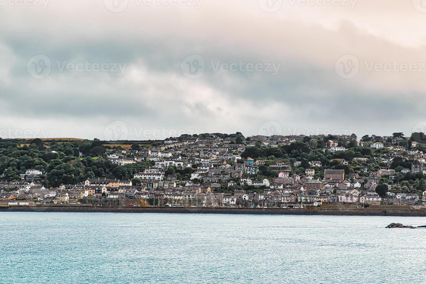 Coastal Town Overlooking Calm Sea in Penzance, Cornwall, UK photo