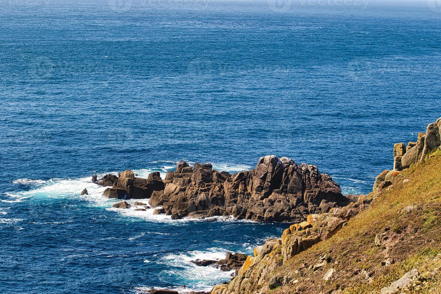 Scenic Coastal View with Rocky Cliffs at Land's End in Cornwall, UK photo