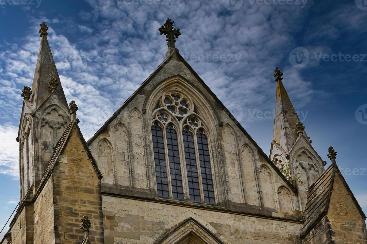 Historic Church with Spires Against Dramatic Sky in Ripon, UK photo