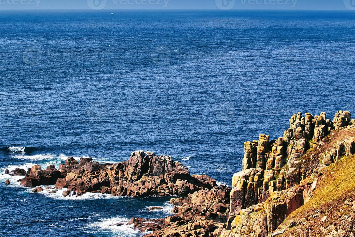 Scenic Coastal Cliffs and Ocean View at Land's End in Cornwall, UK photo