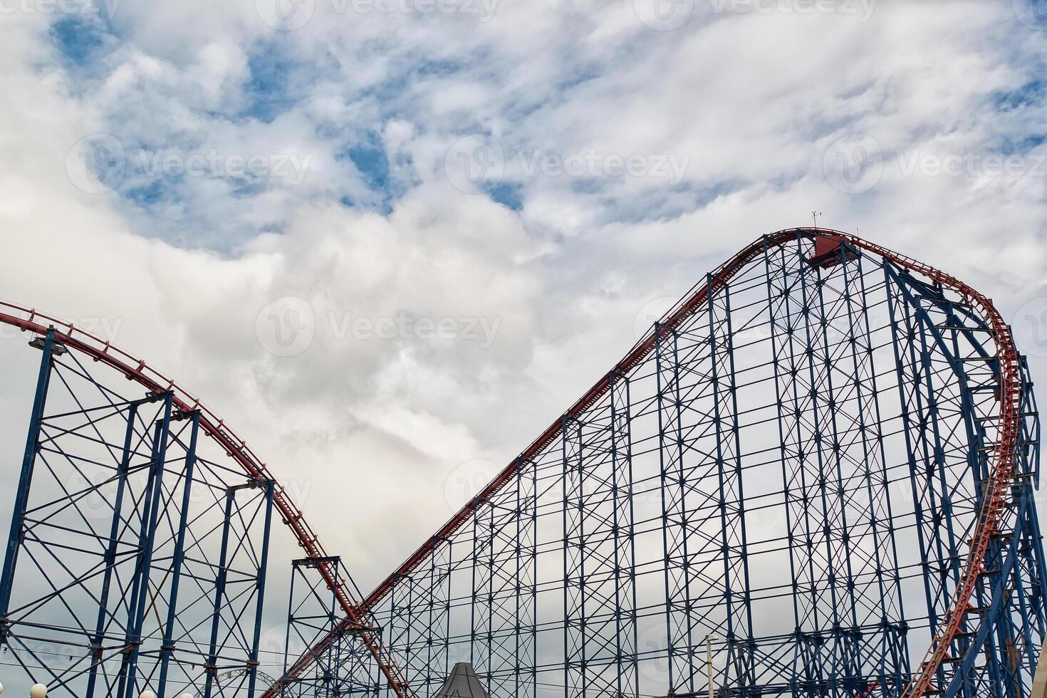 Exciting Roller Coaster Against Cloudy Sky in Blackpool, UK photo