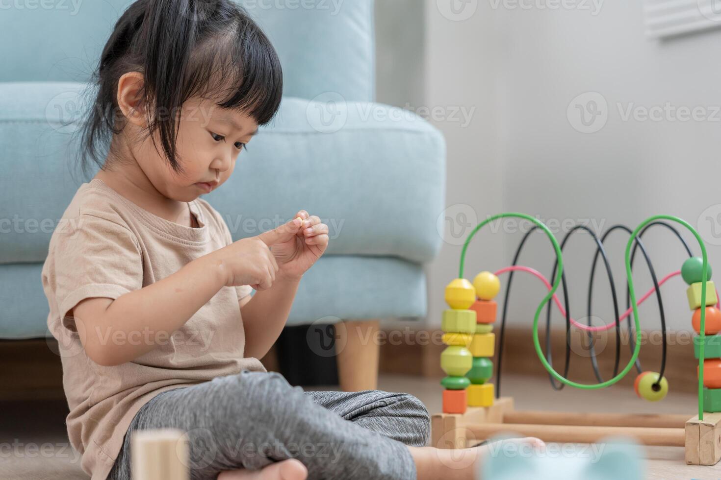 Happy Asian child playing and learning toy blocks. children are very happy and excited at home. child have a great time playing, activities, development, attention deficit hyperactivity disorder photo