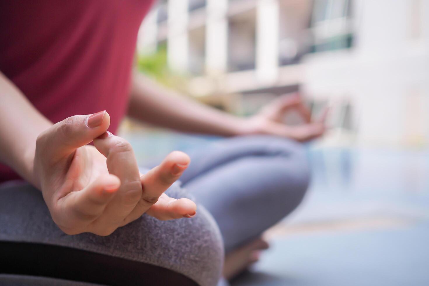 Slim woman practicing yoga on room at condo or home. Asian woman doing exercises in morning. balance, meditation, relaxation, calm, good health, happy, relax, healthy lifestyle, diet, slim photo