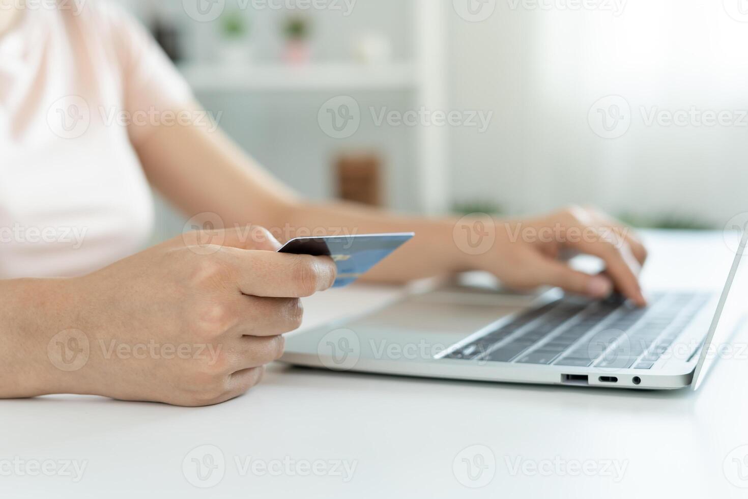 woman using smartphone doing financial transactions through the internet. mobile phone with payment detail page display and credit card, technology, electronic commerce, mobile banking, market place photo