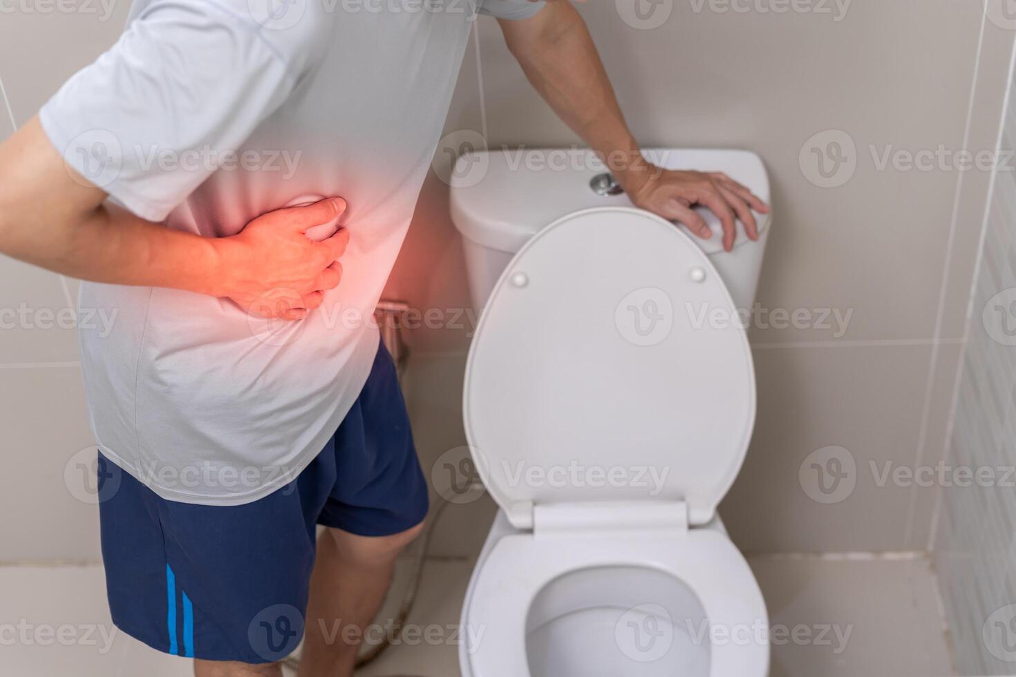Constipation and diarrhea in bathroom. Hurt man touch belly stomach ache painful. colon inflammation problem, toxic food, abdominal pain, abdomen, constipated in toilet, stomachache, Hygiene photo