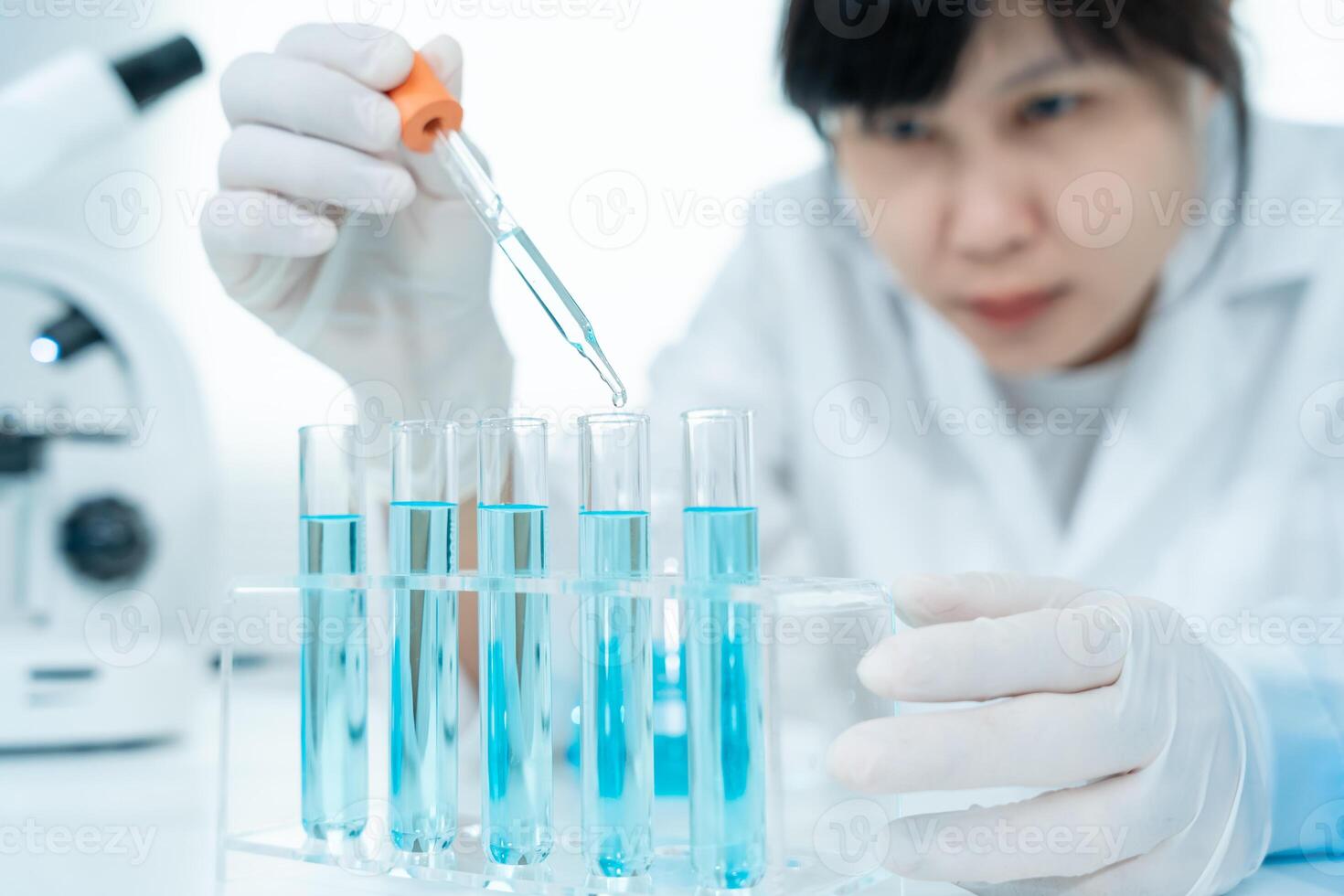 Scientist analyze biochemical samples in advanced scientific laboratory. Medical professional use dropper mix microbiological developmental of viral. Biotechnology research in science lab. cosmetic photo